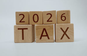 Year-End Tax Planning Checklist for Businesses in 2026 Blocks spell '2026 TAX' on a pale background, stacked in two rows.